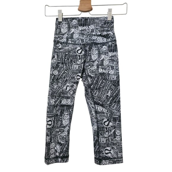 Lululemon Pants - Lululemon Wunder Train High-Rise Tear It Up Alpine White Black Logo Tight Sz 2